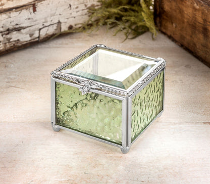 J Devlin Box 929 sage green textured glass keepsake box with a clear beveled lid, silver finish, beaded edging, and decorative filigree.
